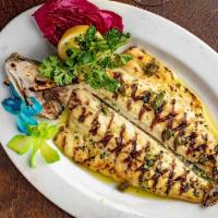 Grilled Branzino · Whole Mediterranean bass served with garlic, parsley, caper and olive oil.