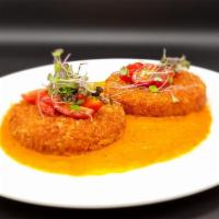 Maryland Crab Cakes · Lump and Jumbo Crab Meat mixed with bread crumbs and served with roasted peppers sauce.