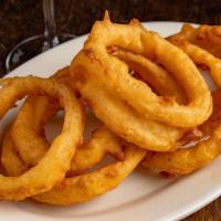 Fried Onion Rings · Fried rings of onions, battered in a flour/buttermilk mix.