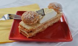St. Honore · Layers of caramelized puff pastry and hazelnut cream,
then topped with smooth vanilla chant...