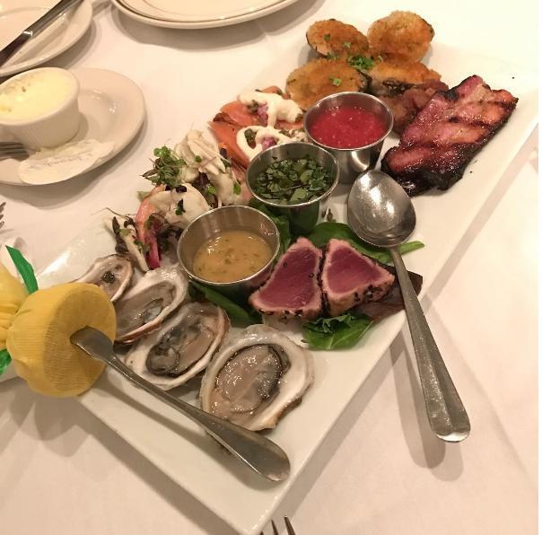 Dinner Sampler for 2 · Seared ahi tuna, oysters on the 1/2 shell, shrimp cocktail, colossal crabmeat cocktail, baked clams, salmon carpaccio, and applewood smoked bacon.