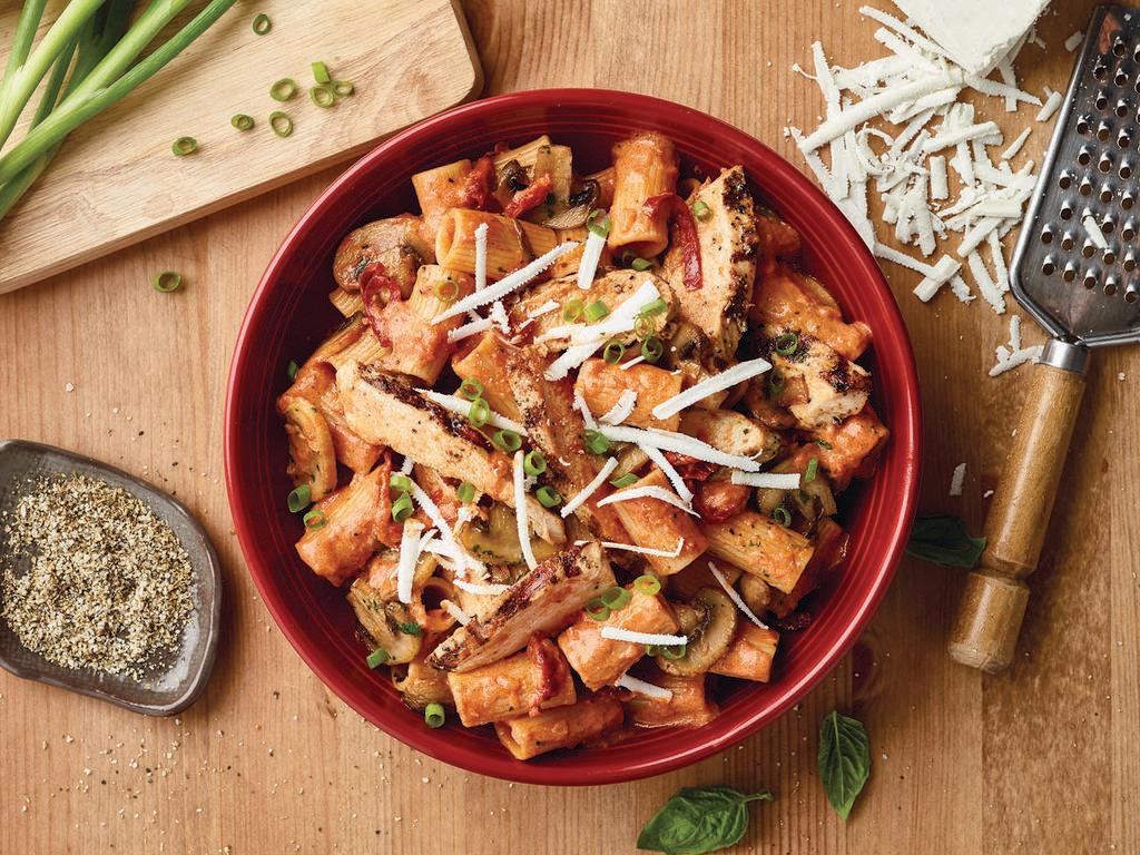 Rigatoni Martino Chicken · Sauteed mushrooms, sun-dried tomatoes, parmesan and romano cheese tossed with rigatoni pasta in our tomato cream sauce topped with scallions and ricotta salata and grilled chicken.