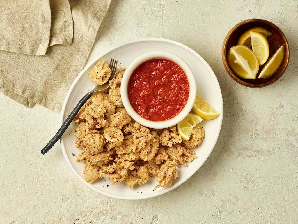 Calamari · Hand-breaded to order and served with our Pomodoro.