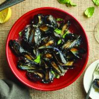 Cozze In Bianco · Mussels steamed in white wine, basil and our lemon butter sauce.