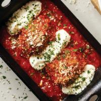 Meatballs and Ricotta · Two meatballs simmered in our pomodoro sauce with ricotta, parmesan and romano cheese.