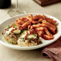 Chicken Bryan · Wood-grilled and topped with goat cheese, sun-dried tomatoes, basil and our lemon butter sau...
