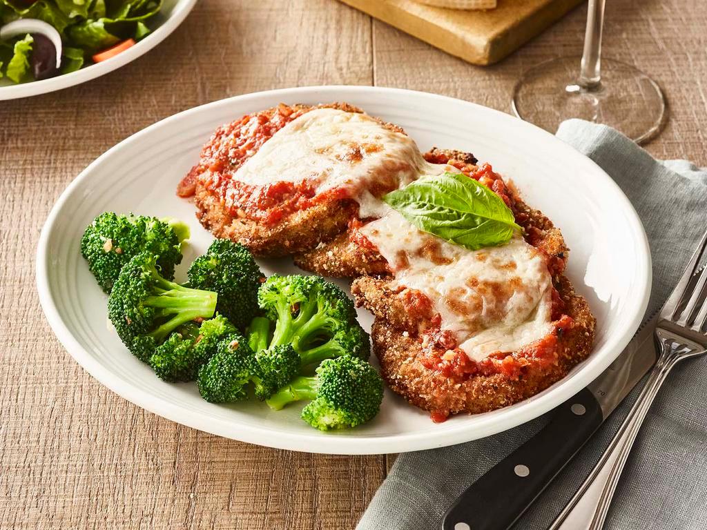 Eggplant Parmesan  · Layers of sliced eggplant coated with seasoned breadcrumbs  and topped with pomodoro  sauce, parmesan, romano and  mozzarella cheese.