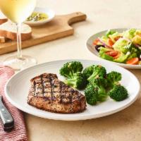 Tuscan-Grilled Pork Chop* · Prepared with Mr. C's Grill Baste, olive oil and herbs. Served simply grilled or with your c...