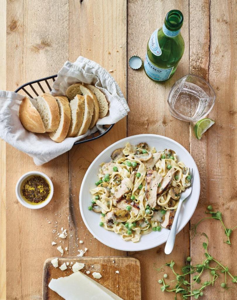 Fettuccine Carrabba · Fettuccine Alfredo with wood-grilled chicken, sautéed mushrooms and peas.