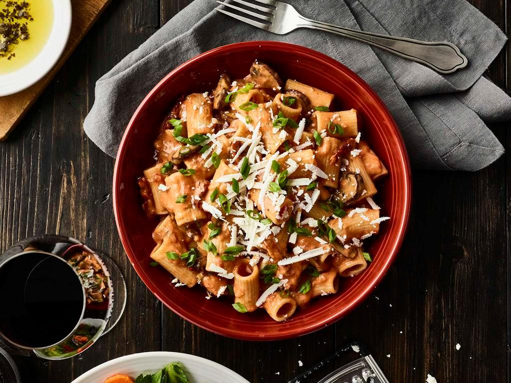 Rigatoni Martino None · Sautéed mushrooms, sun-dried tomatoes, parmesan and romano cheese tossed with rigatoni pasta in our tomato cream sauce topped with scallions and ricotta salata. served with choice of a cup of soup or side salad.