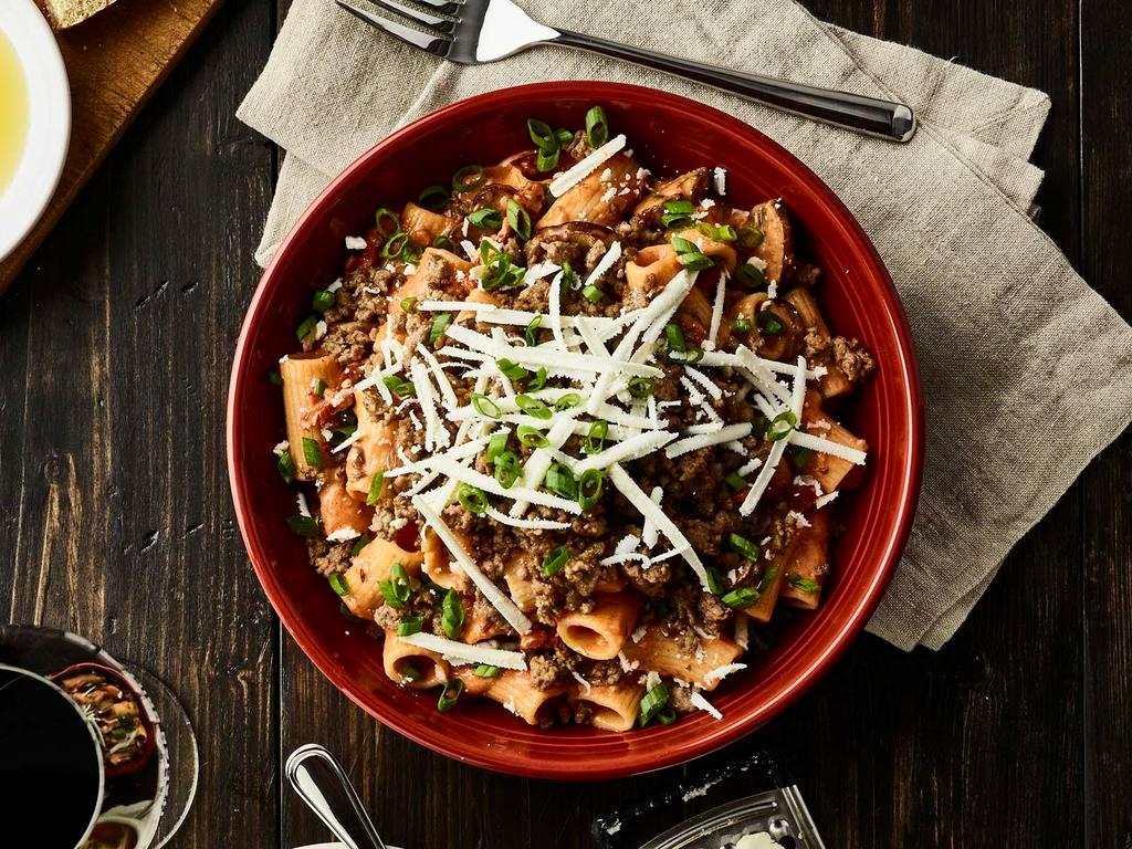 Rigatoni Martino Sausage  · Sauteed mushrooms, sun-dried tomatoes, parmesan and romano cheese tossed with rigatoni pasta in our tomato cream sauce topped with scallions and ricotta salata sausage.