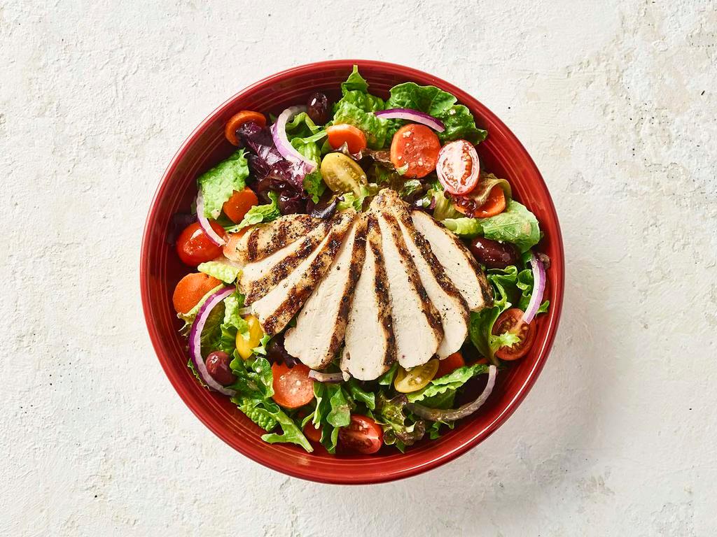 Italian Salad with Chicken · Now with 50% More Chicken! Wood-grilled chicken served over mixed greens, garden vegetables and Kalamata olives with our Italian vinaigrette.
