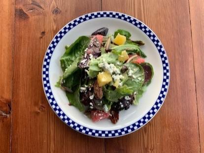 Wild Child Mixed Greens · Organic mixed greens, crumbled bleu cheese, fresh orange and grapefruit, Amy’s candied pecans, and tarragon vinaigrette. Gluten free. Vegetarian.