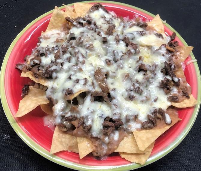 Nachos · Crisp Tortilla Chips topped with Meat, Beans and Cheese.