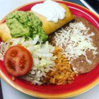 Chimichanga Combo · Choice of Meat, Filled with Cheese, Sour Cream, and Guacamole. Served with a side of Rice an...