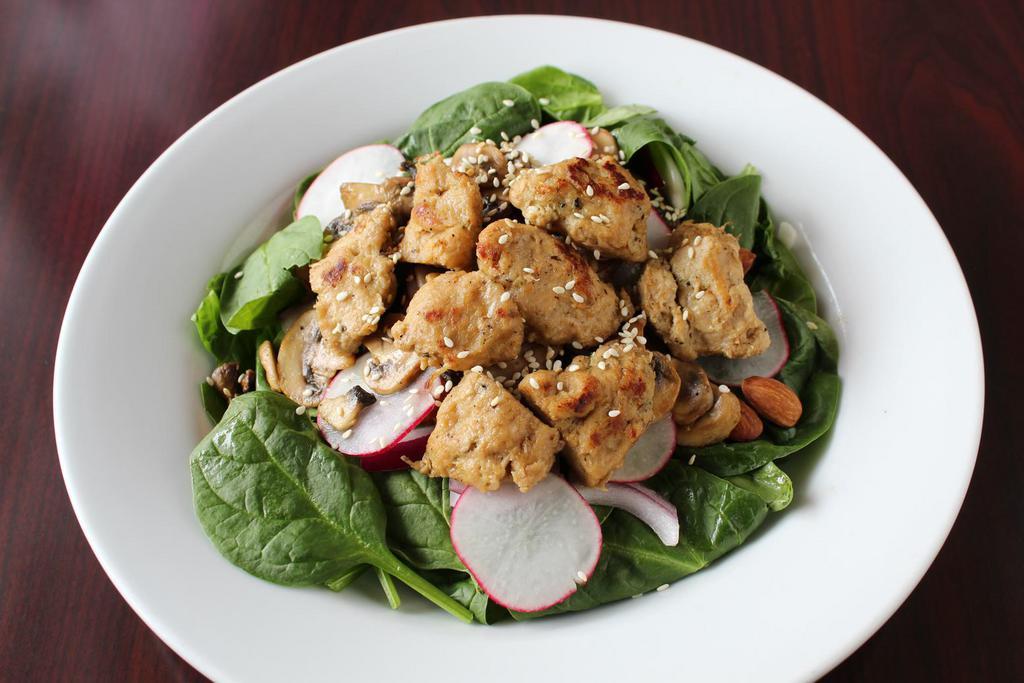 Spinach Salad · Spinach, soy chicken, onion, almonds, mushroom, radishes and sesame seeds mixed with sesame dressing. 