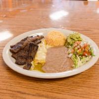 #2. Tampiquena · Beef skirts served with rice, refried beans, pico de gallo, lettuce, guacamole, tortillas an...