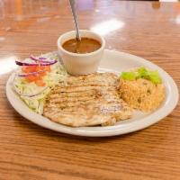 #3. Pechuga a la Parrilla · Chicken breast served with charro beans, rice, tortillas and salad.