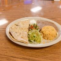 #12. Quesadilla Plate · Our big quesadilla, filled with choice of meat, served with rice, refried beans, guacamole, ...