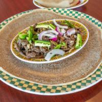  8. Yebeg Tibs · Most popular. Tender marinated lamb, stir-fried with onions, garlic, and tomato.