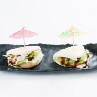 A10. Chashu Bun · 2 pieces. Steamed buns,chashu, mayo, lettuce and sweet sauce.