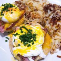 Basic Benedict · Poached eggs, ham off the bone, toasted English muffin, hollandaise, and hash browns.