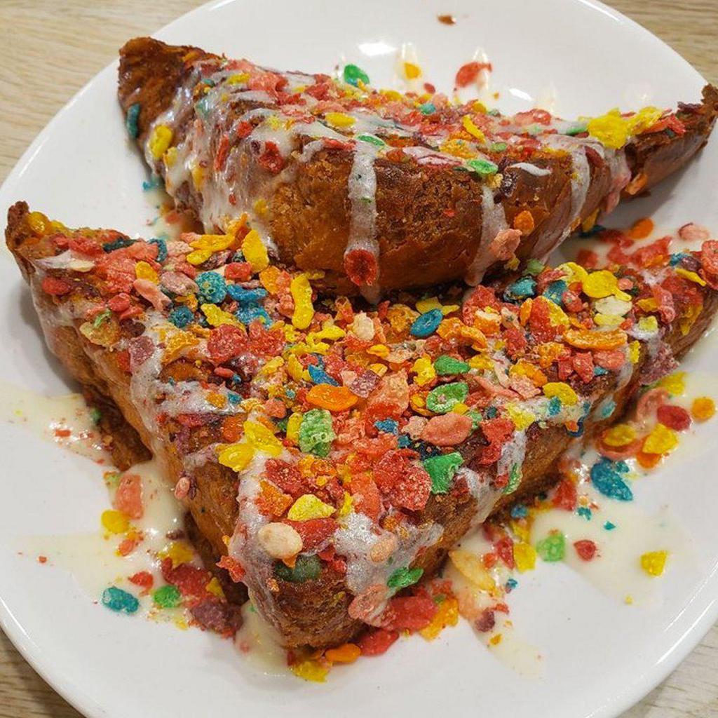 Cereal Killer French Toast · Battered in fruity pebbles and served with a vanilla frosting glaze.
