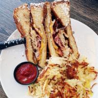 Monte Cristo Sandwich · Fresh sliced ham and turkey served with Swiss and American cheese then battered and fried to...