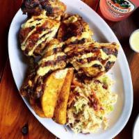 Boneless Thighs - Grilled · Boneless chicken thighs marinated overnight in Fresno pepper sauce, smoked over fruit wood a...