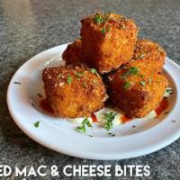 Fried Mac N Cheese Bites · Grandma’s Mac & Cheese, crispy on the outside and gooey on the inside, served with Zesty...