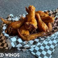 Wings - 24 · Wings are marinated overnight in Fresno Pepper sauce, smoked over fruit wood, then deep frie...