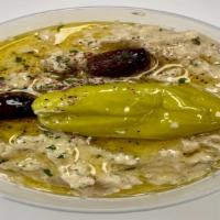 Baba Ghanoush Dip · Baba Ghanoush is made with mashed cooked eggplant, tahini, olive oil, lemon juice, garlic an...