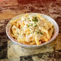 Greek Fries · French fries topped with garlic sauce and feta.