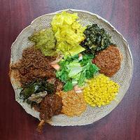 Meat and Veggie Combo No. 1 · Mild and spicy. Spicy lentils, yellow peas, collard greens, cabbage, shiro, house salad, key wot, alicha wot, gomen besega, door wot and menchet abesh. Spicy.