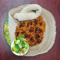 Qwanta Fir-fir · Dried beef jerky in spicy wot stew mixed with injera. Spicy.