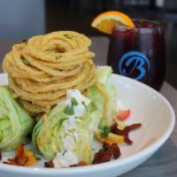 Wedge Salad  · Baby iceberg, slab bacon, heirloom grape tomatoes, frizzled onions and buttermilk bleu. 
