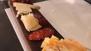 1/2 and 1/2 Board · Local cheese and charcuterie - house country mustard, peach chutney, candied nuts, honey, an...
