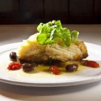 Baked codfish (Bacalhau Assado) · with onions, potatoes and olives, served with rice and beans. (servido com arroz e feijao.) ...