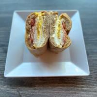 Breakfast Club · 2 (Hard) Fried Eggs, Bacon, Smoked Turkey, Cream Cheese, and Tomato, served on a sundried to...