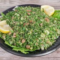 Tabbouleh Salad · Salad mixed with parsley, cracked wheat, tomato, fresh mint, lemon juice and olive oil.