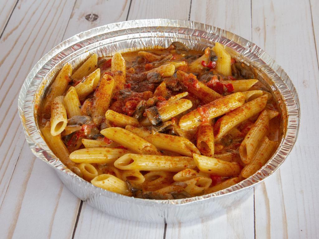 Spicy Penne · Chicken and mushrooms in pink sauce.