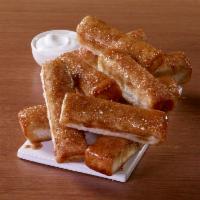 Cinnamon Sticks · Sprinkled with Cinnamon and sugar and served with icing dipping sauce.