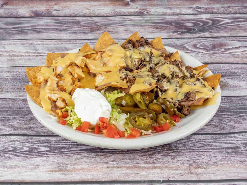 Nachos (Chicken Fajita, Beef Fajita or Shrimp)  · Nachos chips smothered with refried beans and your choice of (Chicken Fajita, Beef Fajita or Shrimp) and Chile con queso, tomatoes, sour cream, and jalapenos.