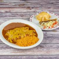 Tequila Dinner · Crispy ground beef taco, queso puff, and 2 ground beef enchilada covered with gravy and chee...