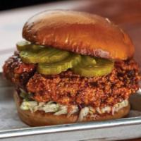 Nashville Hot Sandwich · Hand Battered Chicken, House-Made Hot Sauce, Sweet Slaw, Onions and Pickles. (Served with Fr...