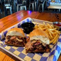 Cheesy Brisket Dip · Smoked Brisket, Caramelized Red Onions, Provolone Cheese, Shiner BBQ Sauce served with House...