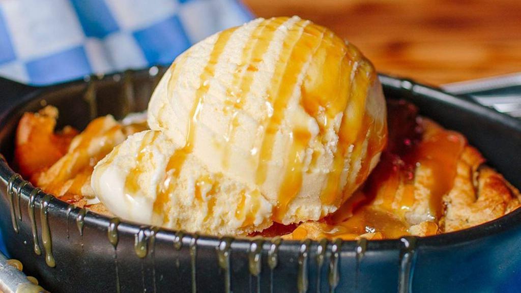 Sizzling Apple Pie · Skillet Apple Pie served with Sweet Bourbon Caramel Sauce