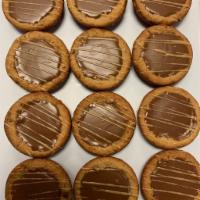 Peanut Butter Cookie Cups · Peanut Butter Cookie Cup filled With Nestle's Home Made Chocolate and Drizzled With Peanut B...