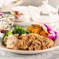 Hand Carved Turkey Breast Dinner · Orange cranberry glazed hand carved turkey breast, sage and onion stuffing, gravy, mashed po...