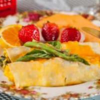 Veggie Crepes Brunch · 2 Parisian crepes filled with scrambled eggs, cheddar cheese, asparagus, mushrooms, and spin...